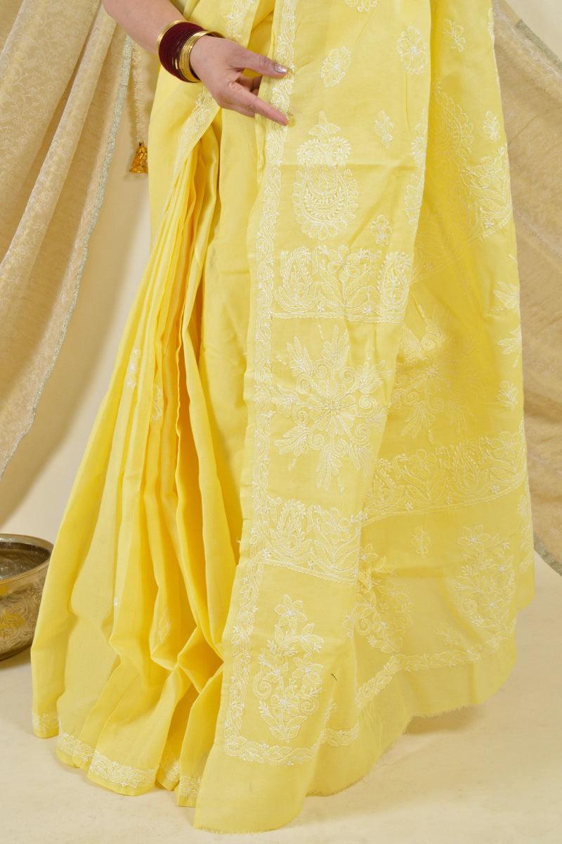 Handcrafted Yellow Saree with intricate Lucknowi Chikankari embroidery and a matching blouse, ideal for festive and wedding occasions.