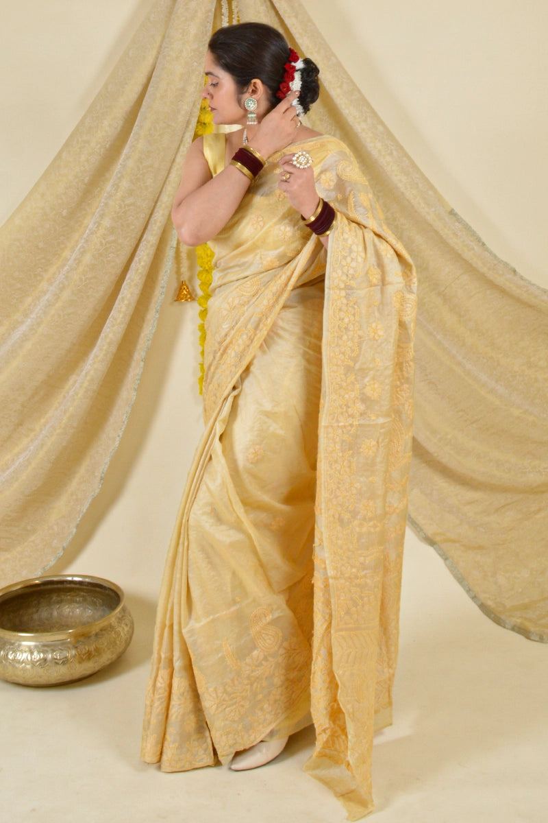 Handcrafted Brown Tussar Silk saree with intricate Lucknowi Chikankari embroidery and a matching blouse, ideal for festive and wedding occasions.