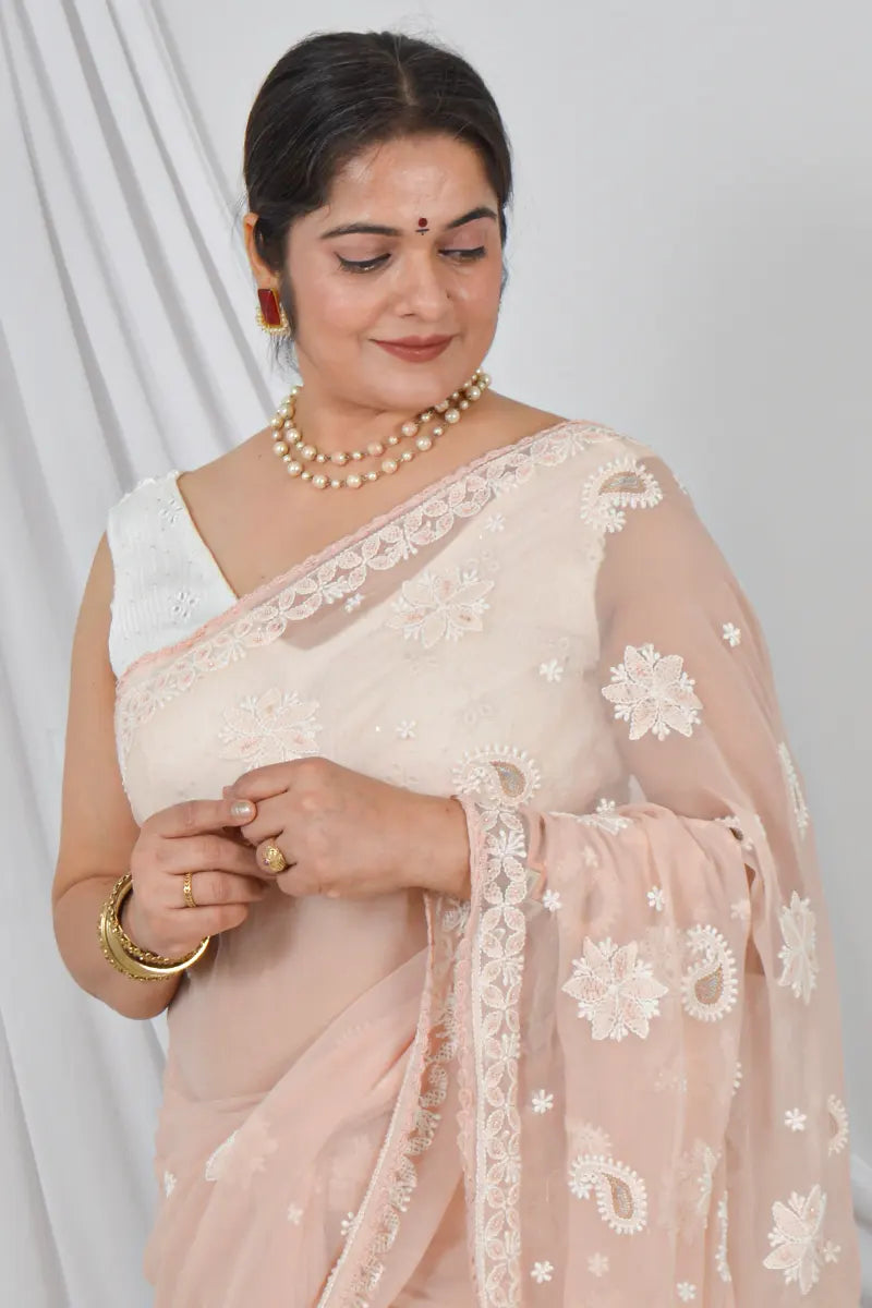 Handcrafted Light Beige Georgette Saree with intricate Lucknowi Chikankari Embroidery and a matching Blouse, ideal for Festive and occasions.