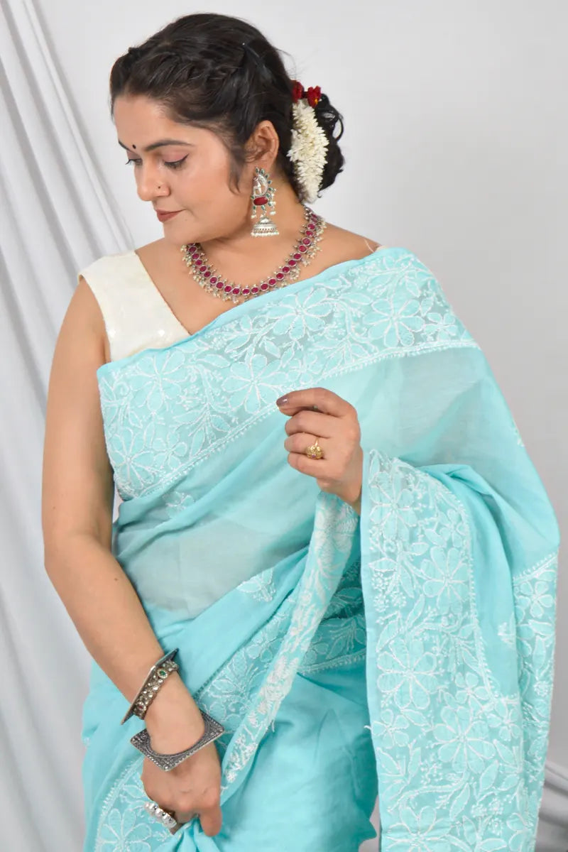 Handcrafted Sky Blue Border Palla Cotton saree with intricate Lucknowi Chikankari embroidery and a matching blouse, ideal for festive and wedding .