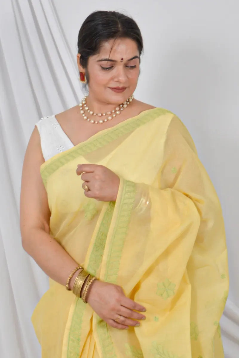 Handcrafted Yellow Cotton Saree with intricate Lucknowi Chikankari embroidery and a matching Blouse, ideal for Festive and  occasions.
