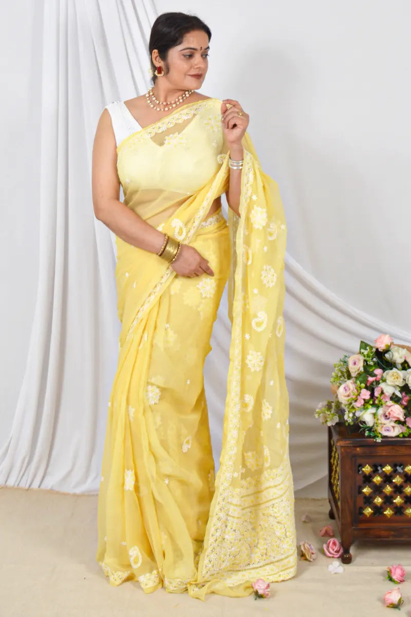 Handcrafted Yellow Georgette Saree with intricate Lucknowi Chikankari Embroidery and a matching Blouse, ideal for Festive and  occasions.