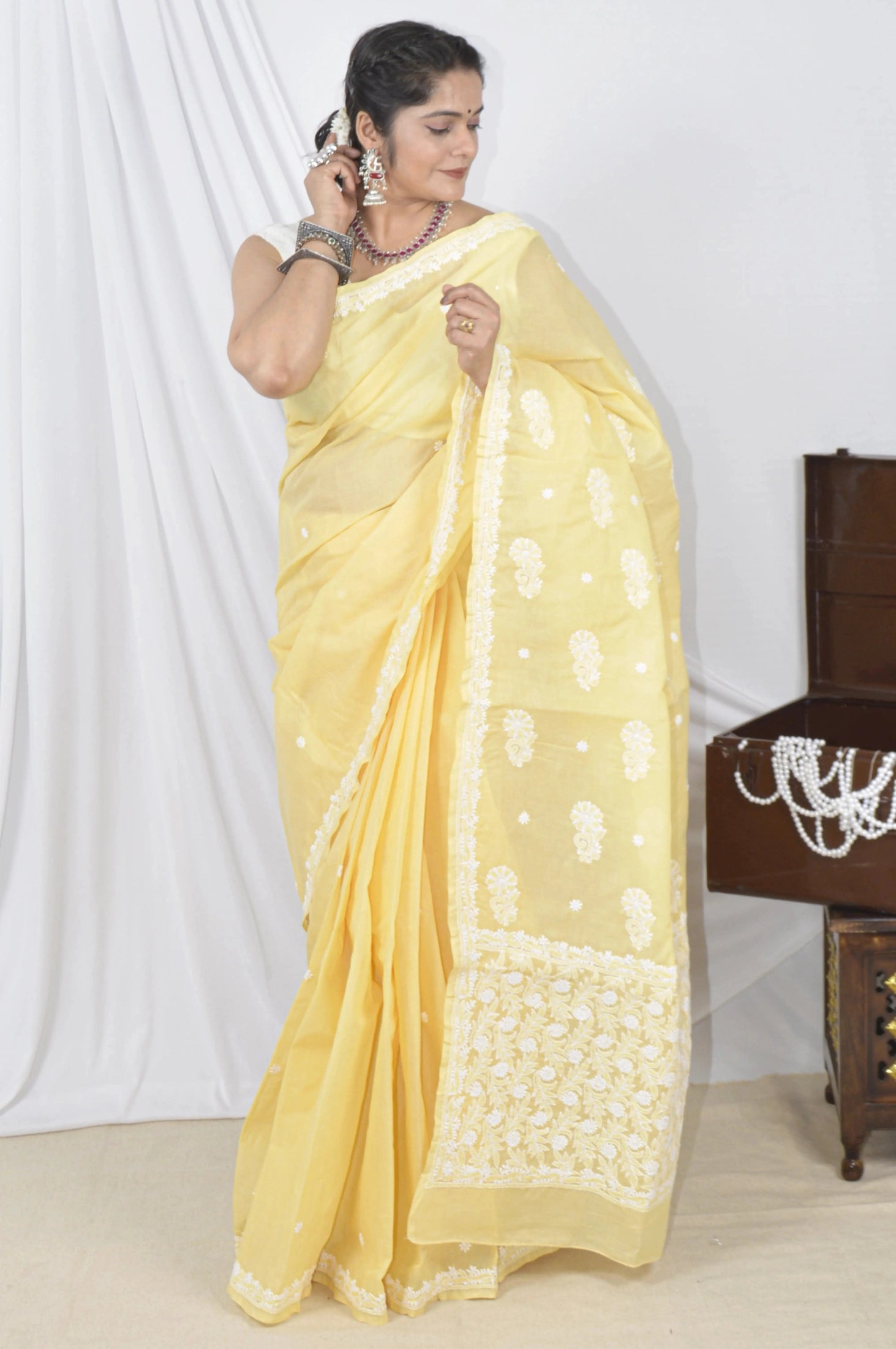 Handcrafted Yellow Designer Cotton saree with intricate Lucknowi Chikankari embroidery and a matching blouse, ideal for festive and wedding .